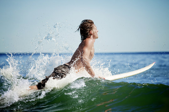 Surfer surfing in sea