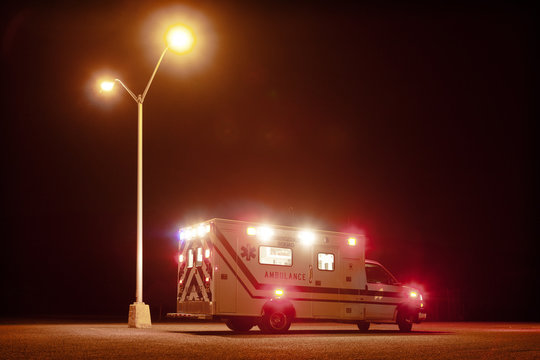 Ambulance on road at night