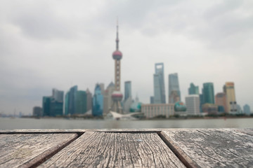 Obraz premium wood of table top on blur of Shanghai view