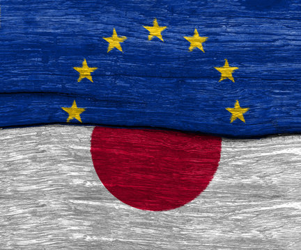EU and japan flag on wood texture background floor