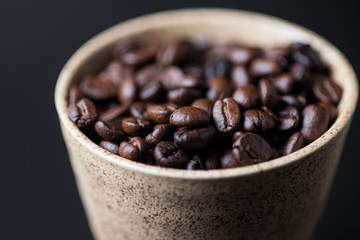 Roast Coffee bean in ceramic cup