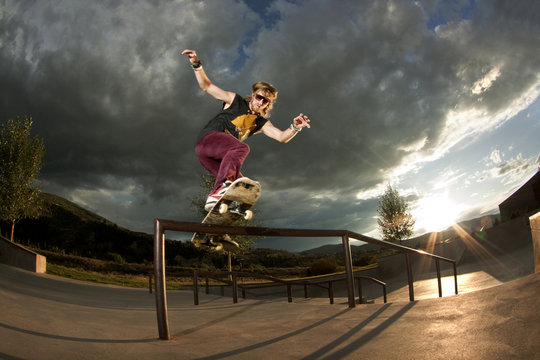 Skater Doing Frontside Railslide Trick