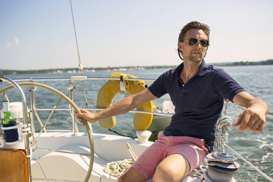 Man looking away while traveling in yacht