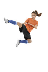 Asian female football player kick ball