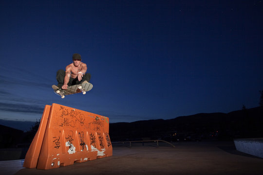 Skateboarder doing frontside grab