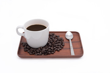 Coffee cup and beans on wooden tray isolate on white background