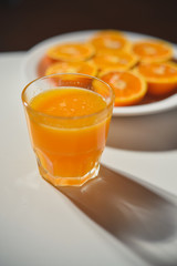 Top view of fresh sliced orange close-up on plate