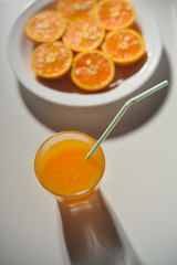 Top view of fresh sliced orange close-up on plate