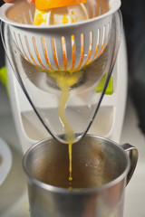 Orange juice maker squeezer closeup