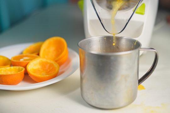 Orange juice maker squeezer closeup