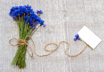 bouquet of cornflowers and label for text.