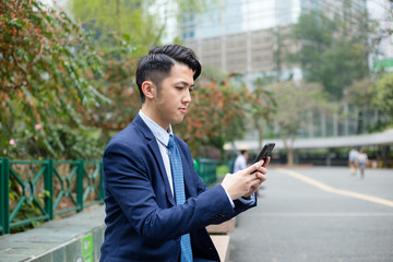 Asian businessman use of mobile phone