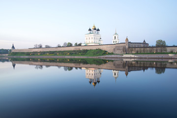 Fototapeta na wymiar Pskov Kremlin in the may twilight from the side of the Great river. Russia