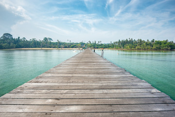 Fototapeta premium Wooden bridge on sea for entry to the beautiful island