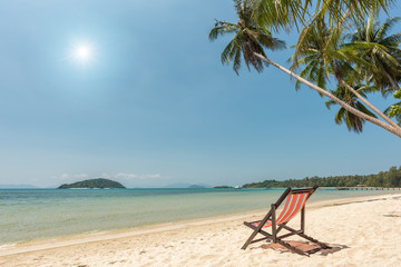 Beach chairs on the white sand beach, Sun, Beautiful beach and tropical sea, Wave of the sea on the sand beach