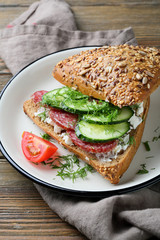 sandwich with cucumber and sausage