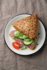 sandwich with cucumber on plate