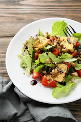 healthy salad with roasted tofu and strawberries