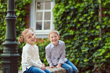 Happy little brother and sister playing