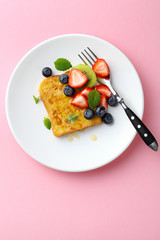 toast with fruits on pink background