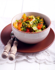 Courgette, peas, carrot and tomato casserole