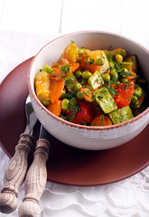 Courgette, peas, carrot and tomato casserole
