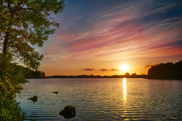 Sunset over Sunowo Lake. Masuria. Poland - obrazy, fototapety, plakaty