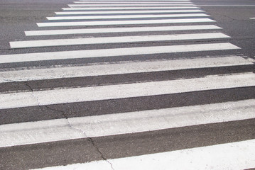 Pedestrian crossing on the road in the form of a zebra
