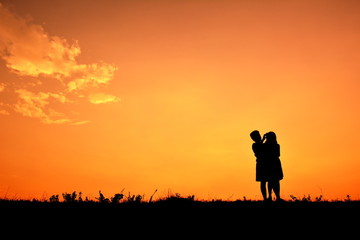 Fototapeta premium Silhouette children at sky sunset