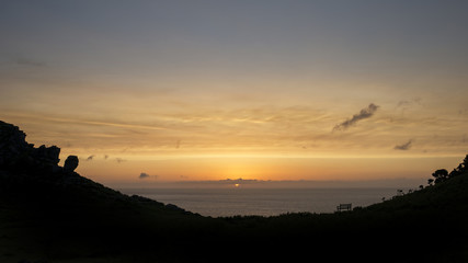 Silhouette landscape image of Valley Of The Rocks in Devon at su