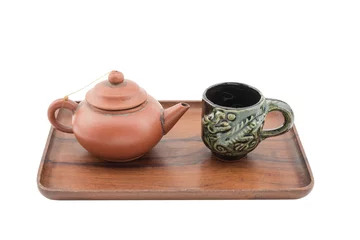 Foto op Aluminium Chinese brown teapot and teacups on the wooden tray isolated on white background © EmBaSy