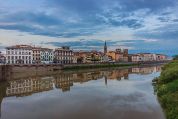 Arno river in Florence (Firenze), Tuscany, Italy,buildings reflected on the water 