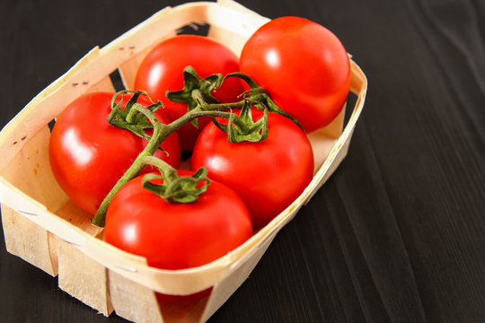 Top view of fresh tomatoes, isolated on dark background