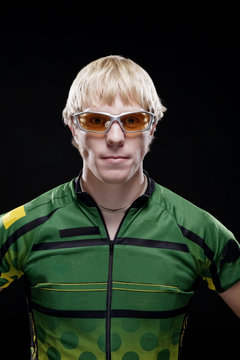 Portrait of man sportsperson standing against black background