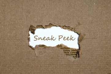 The word sneak peek appearing behind torn paper. - 113213215