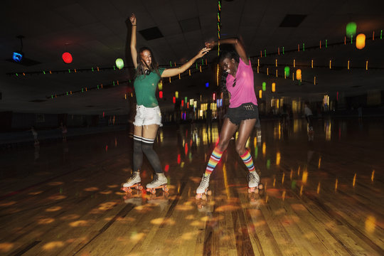 Young women roller skating