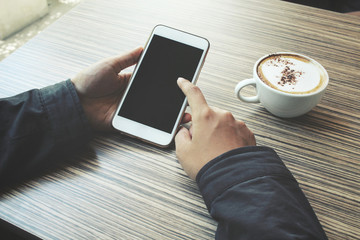 Woman drink coffee with smart phone