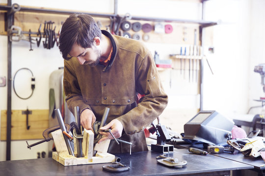 Young man working in workshop