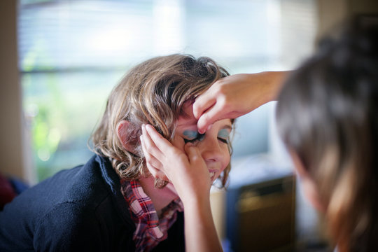 Two girls (6-7,  8-9) playing with make-up, ,