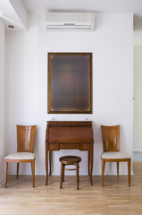 Classic interior with two chair and secretary table