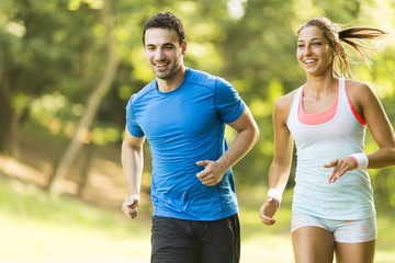 Fototapeta na wymiar Young couple running
