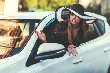 Woman in the car.