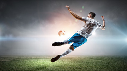 Soccer player hitting ball