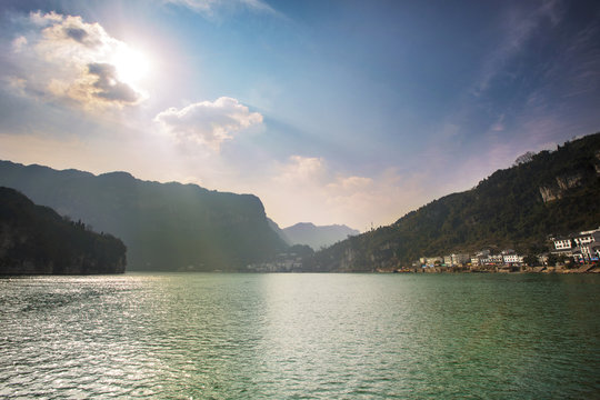 View of tranquil Yangtze River on sunny day and village in background