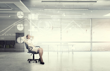 Businesswoman having rest in office