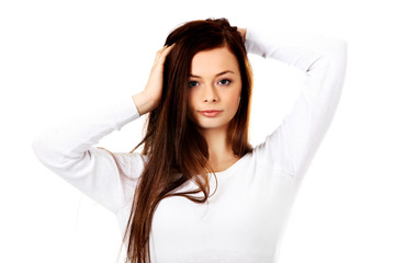 Naklejka premium Young beautiful woman massaging her own hairs
