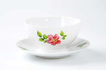 white tea cup with floral decor