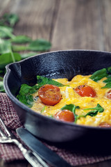 Spinach frittata in iron skillet  with copy space