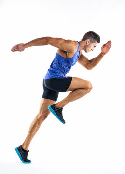 Full Length Portrait Of A Fitness Man Running Isolated On A White Background