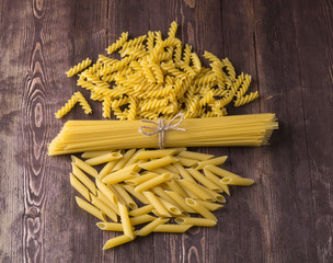 Pasta with different types of italian pasta. Uncooked pasta  on the table. mixed dried pasta selection.